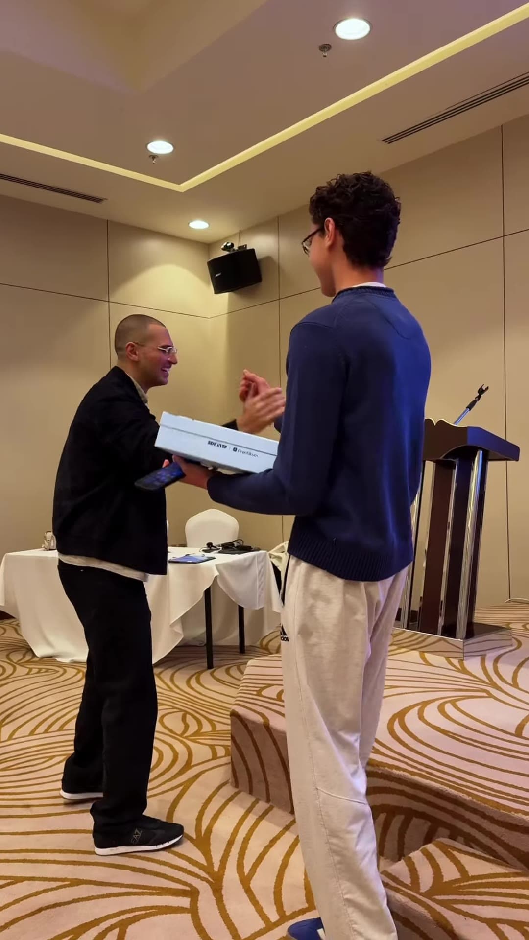 A student receiving a prize on stage